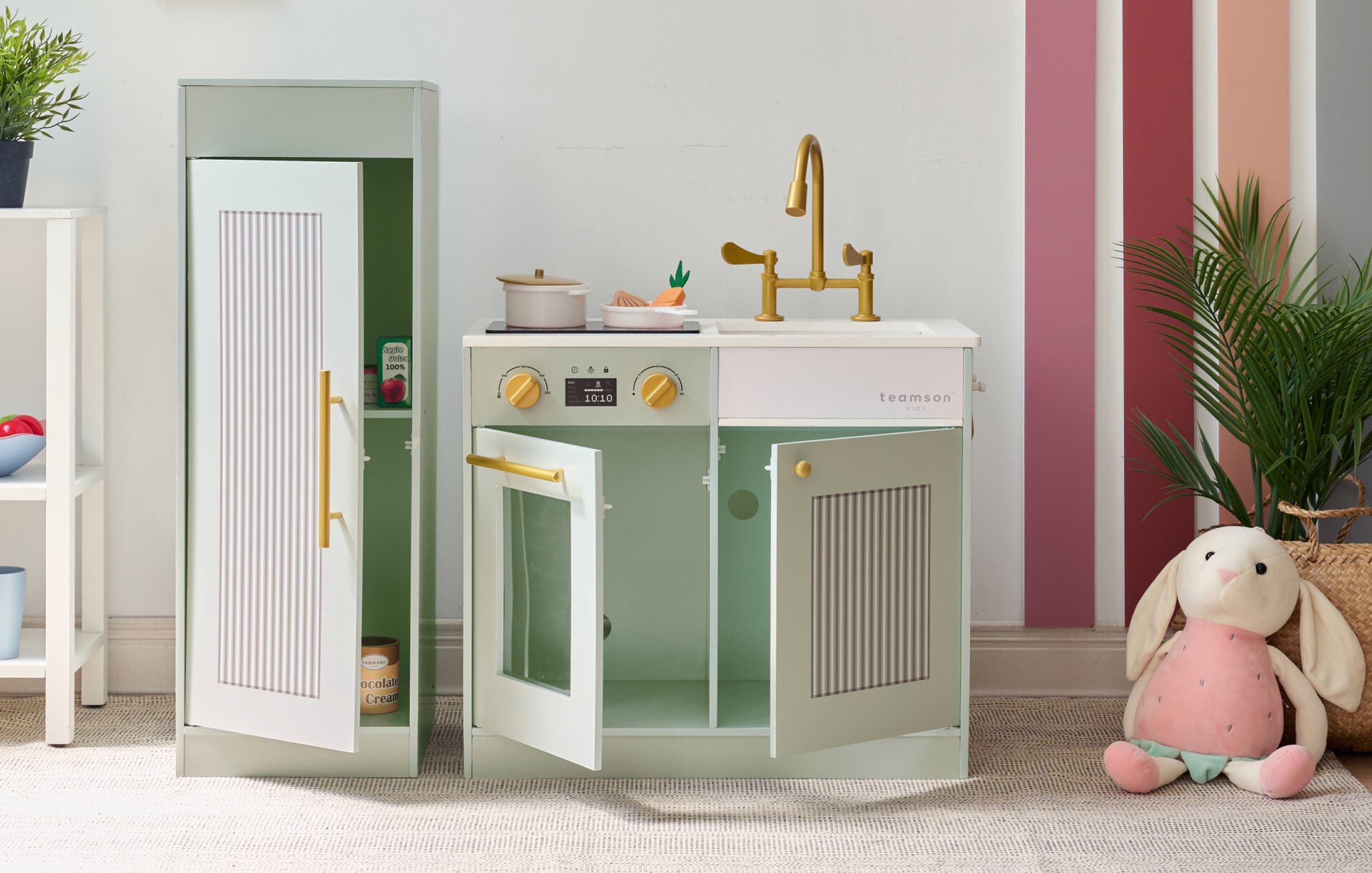 children playing with pretend kitchen set
